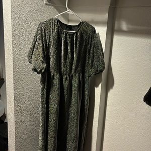 Silver shimmery midi dress with sleeves.